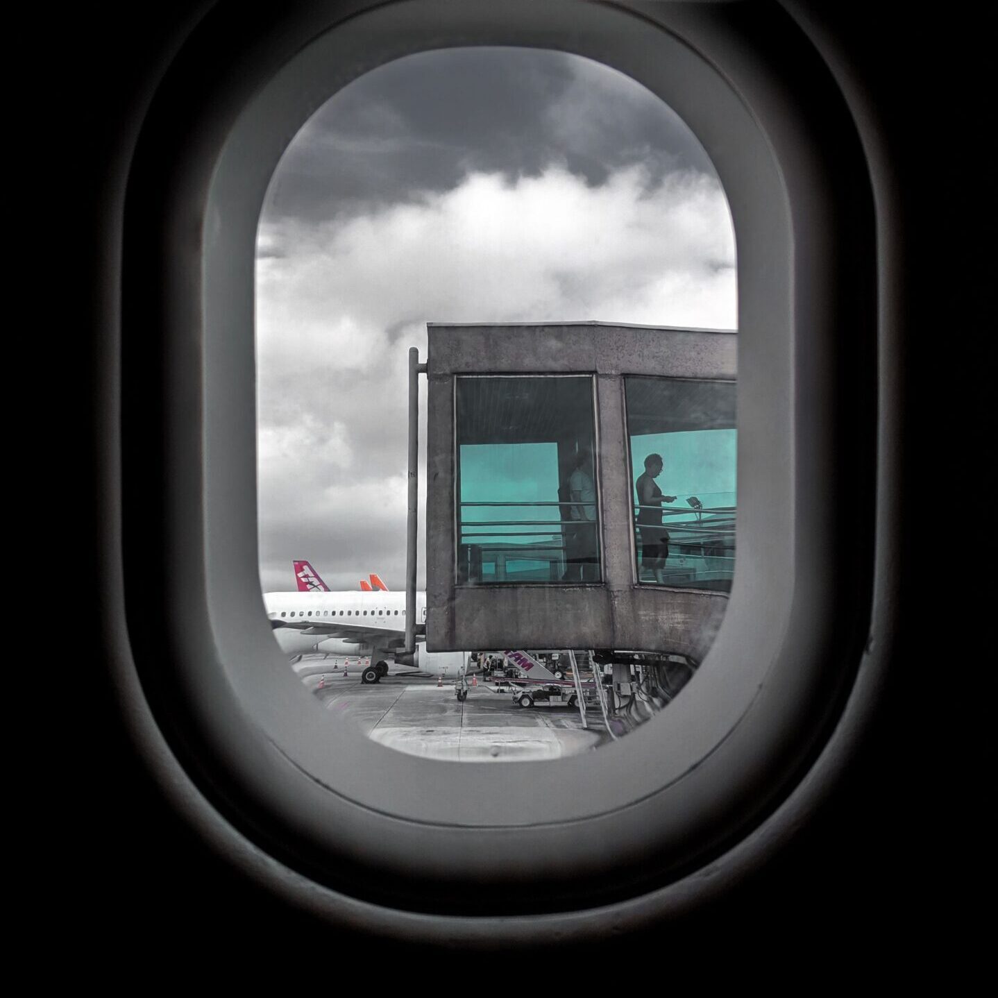 View of gray clouds from an airplane window