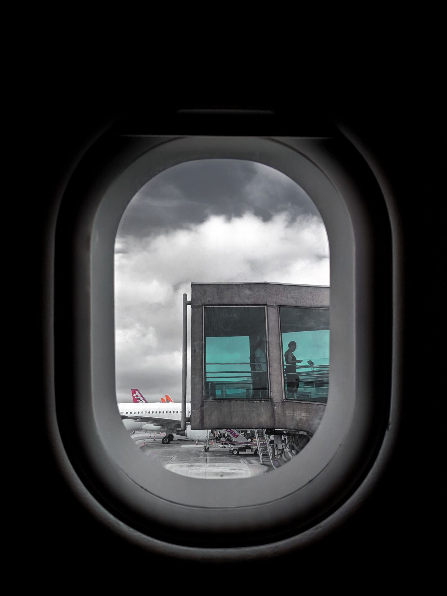 View of gray clouds from an airplane window